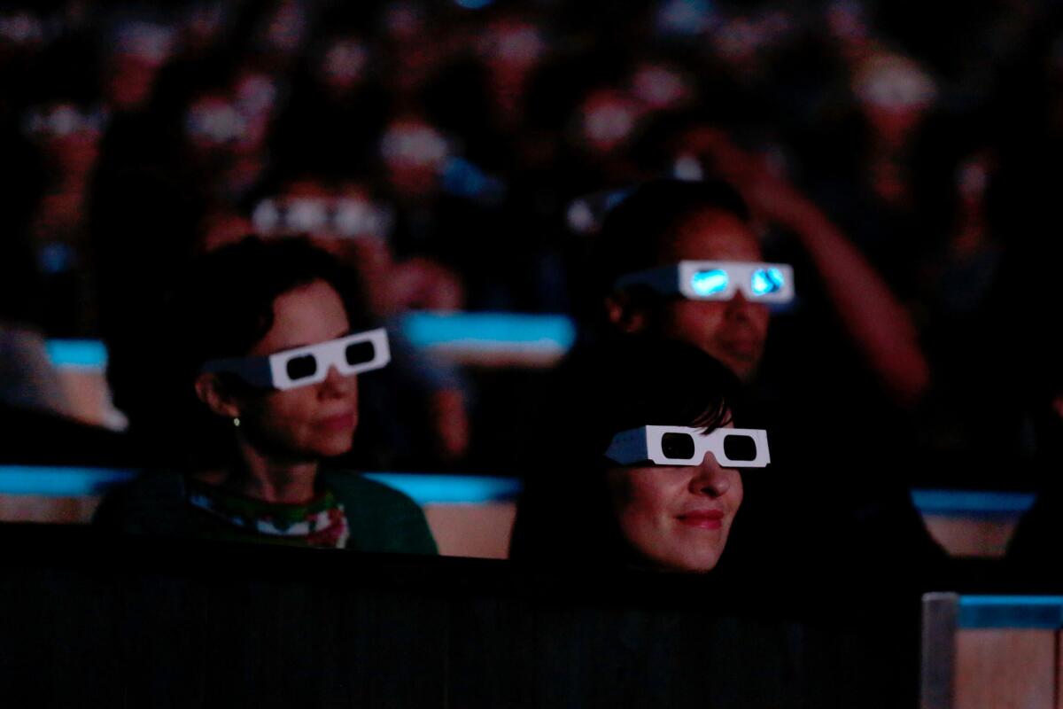 Fans in 3-D glasses experience Kraftwerk's performance at the Hollywood Bowl.