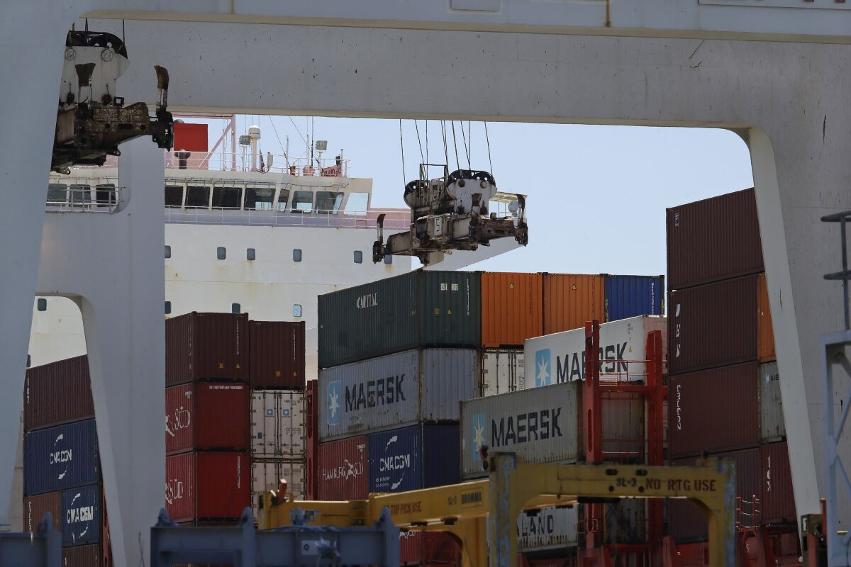 FILE - In this July 22, 2019, the container ship Kota Ekspres is unloaded at the Port of Oakland in Oakland, Calif. On Wednesday, Oct. 30, the Commerce Department issues the first estimate of how the U.S. economy performed in the July-September quarter. (AP Photo/Ben Margot, File)