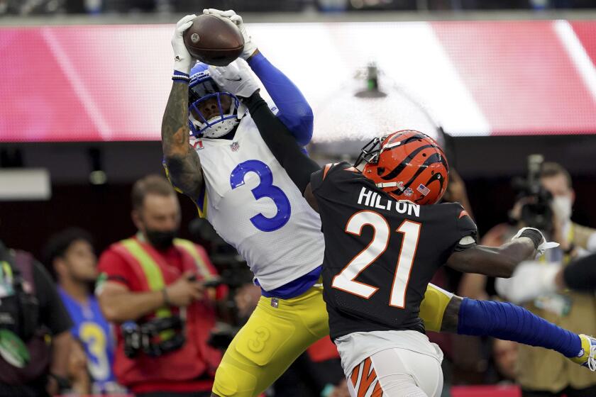 Los Angeles Rams wide receiver Odell Beckham Jr. (3) catches a touchdown pass against Cincinnati Bengals cornerback Mike Hilton (21) in Super Bowl 56, Sunday, Feb. 13, 2022 in Inglewood, CA. (AP Photo/Doug Benc)