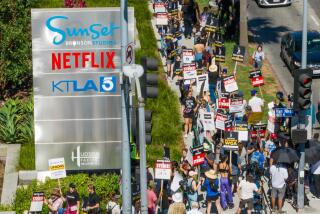 LOS ANGELES, CA - JULY 14: SAG-AFTRA members take to the picket line outside Netflix on Sunset Boulevard and Van Ness Avenue in Los Angeles, CA on Friday, July 14, 2023. Actors join striking writers who have been on the picket lines since the beginning of May. (Myung J. Chun / Los Angeles Times)