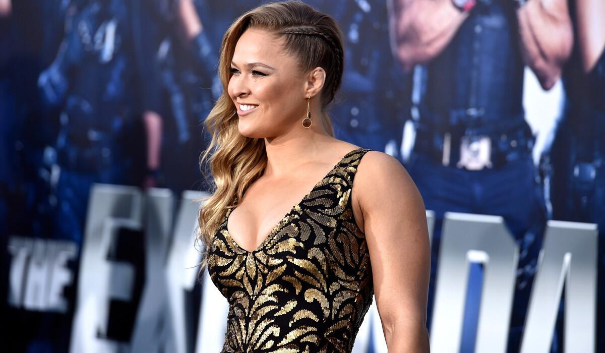 UFC bantamweight champion Ronda Rousey, seen here at a premiere for "The Expendables 3," is encouraged by steps UFC is taking in drug testing.