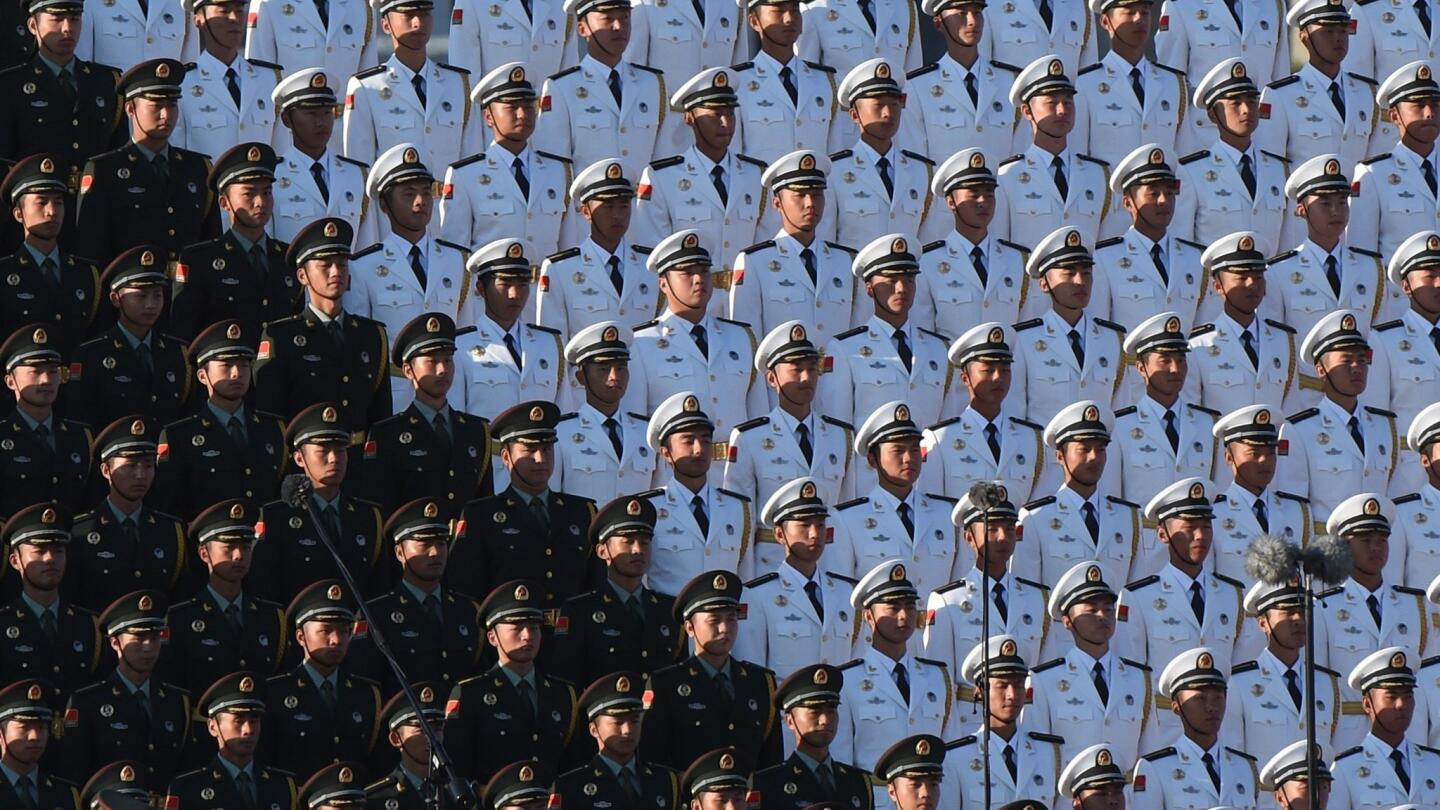 A Chinese military choir stands in position ahead of a military parade at Tiananmen Square in Beijing.