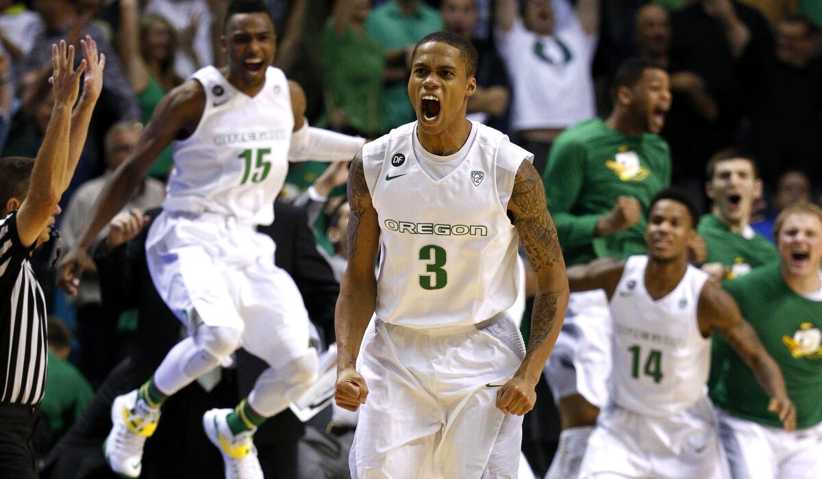 Oregon guard Joseph Young (3) celebrates after making a three-point shot in the final seconds to defeat Utah in a Pac-12 tournament semifinal Friday night.