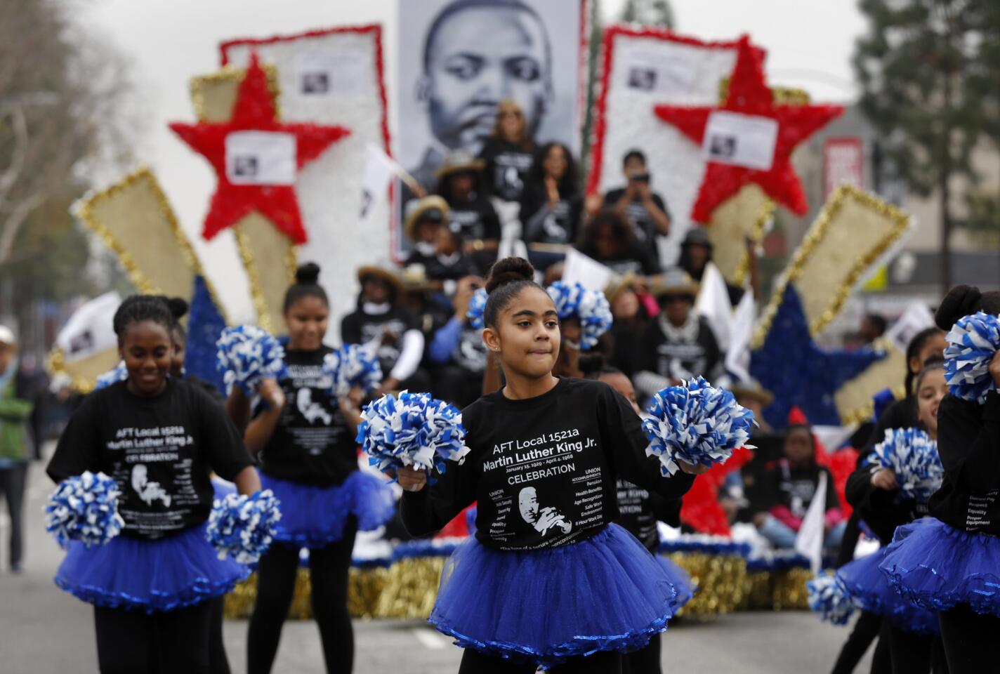 Marching groups and drill teams, such as the one from the American Federation of Teachers Local 1521, make their way down Martin Luther King Boulevard in South Los Angeles during the 31st Kingdom Day Parade on Monday.