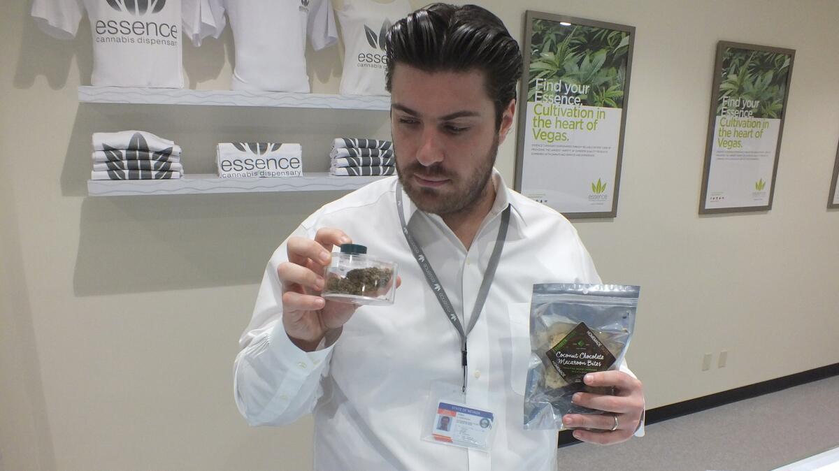 Armen Yemenidjian, founder of Essence Cannabis Dispensary, holds dried marijuana flowers and pot-laced cookies. They're among the many products medical marijuana cardholders, including those from California, can buy at the company's new store on the Las Vegas Strip.