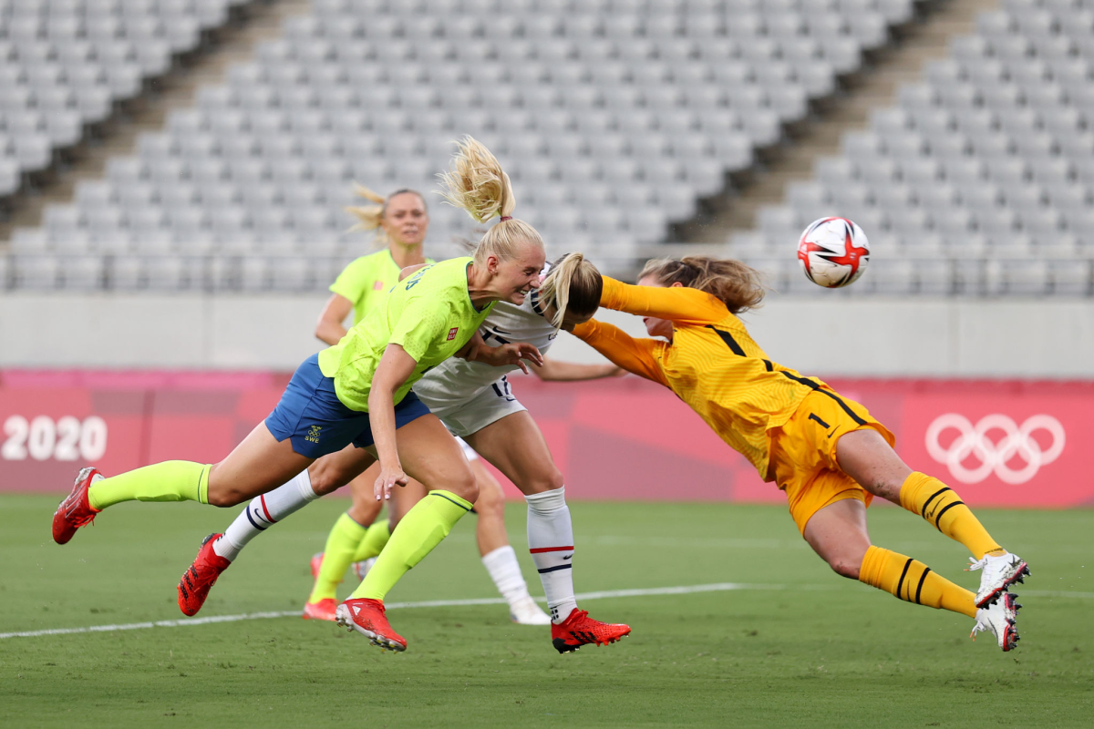 Stina Blackstenius scores past Alyssa Naeher at the Tokyo Olympics.