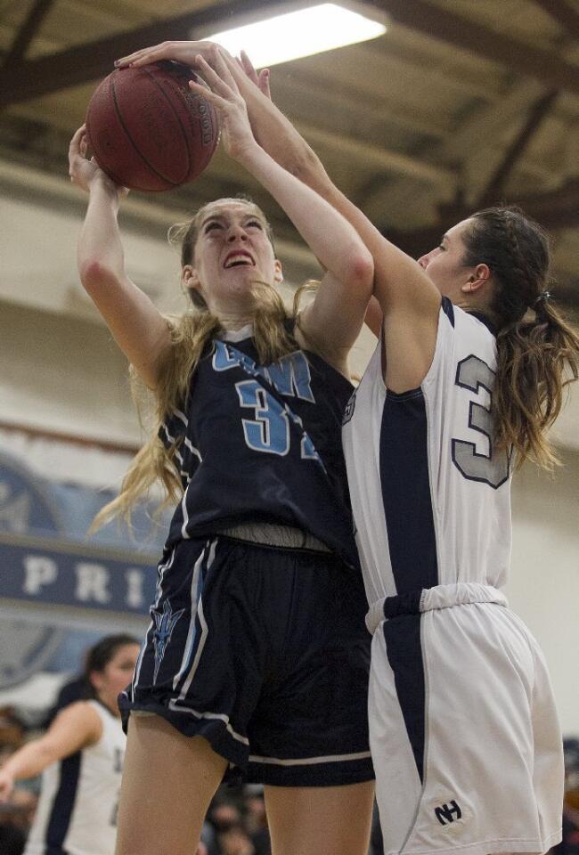 Corona del Mar High's Natalia Bruening goes up for a shot against Newport Harbor's Kendra Munguia during a game on Tuesday.