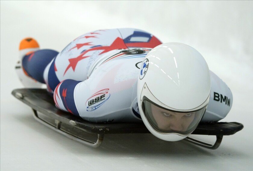 Kelly Curtis of United States speeds down the track during the woman Skeleton World Cup race in Sigulda, Latvia, Friday, Dec. 31, 2021. (AP Photo/Roman Koksarov)