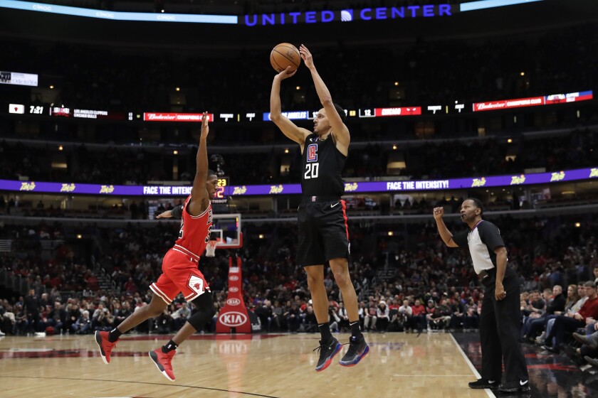 Clippers guard Landry Shamet shoots over Bulls forward Kris Dunn during the first half of a game Dec. 14.