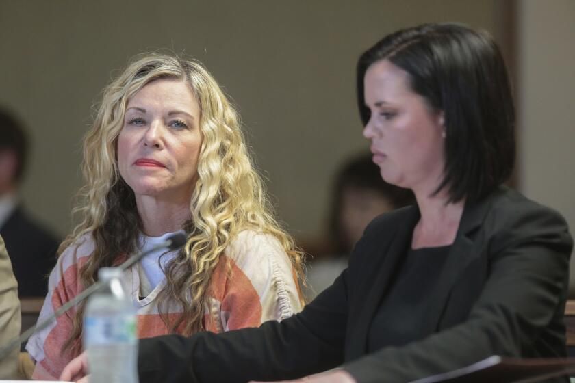 FILE - In this March 6, 2020, file photo, Lori Vallow Daybell glances at the camera during her hearing, with her defense attorney, Edwina Elcox, right, in Rexburg, Idaho. The bodies of two children uncovered in rural Idaho are a boy and his big sister who have been missing since September, relatives said Wednesday, June 10, bringing a grim end to a search that captivated people worldwide. Authorities have not released the identities of the bodies discovered on the property of Chad Daybell, who married the children's mother, Lori Vallow Daybell, a few weeks after the kids were last seen. Both their mother and her husband are behind bars. (John Roark/The Idaho Post-Register via AP, Pool, File)