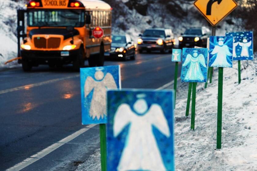 A bus traveling from Newtown, Conn., to nearby Monroe passes 26 angels representing those killed at Sandy Hook Elementary School.
