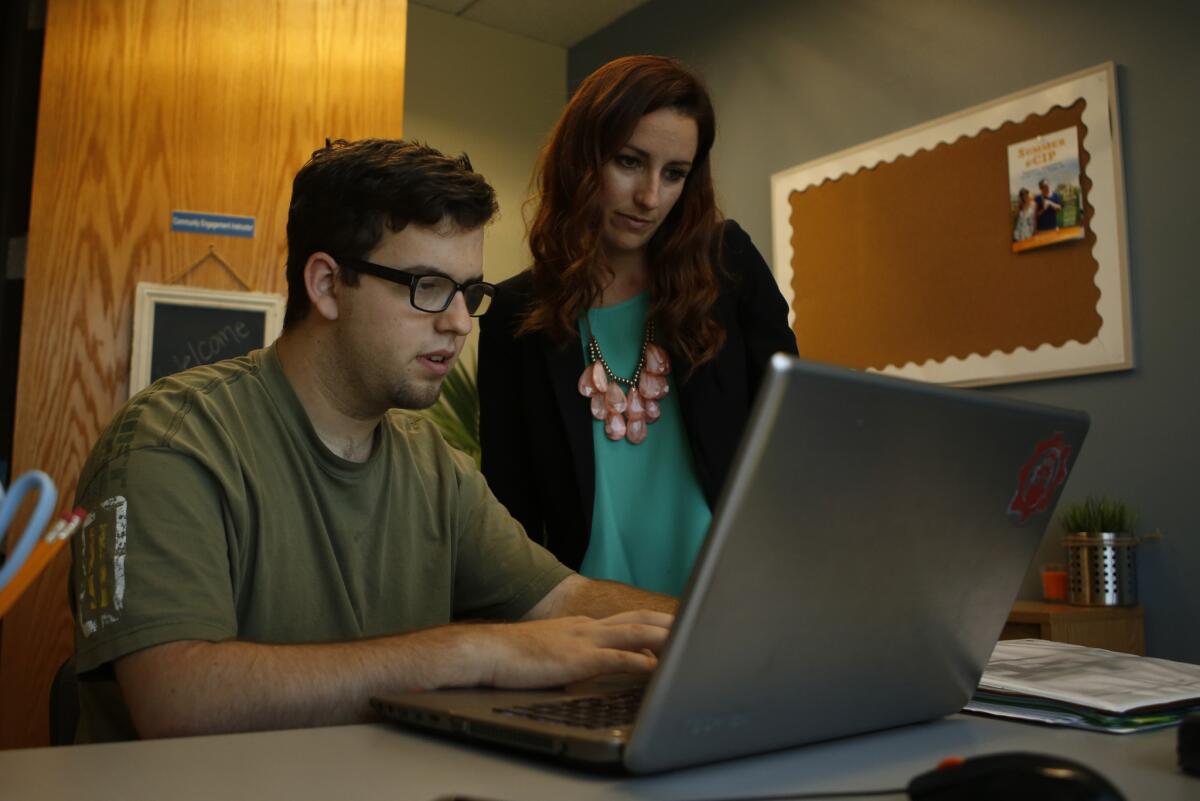 Grant Campbell, 21, works with Academic Coach Shantae Short at CIP in Long Beach on April 13.