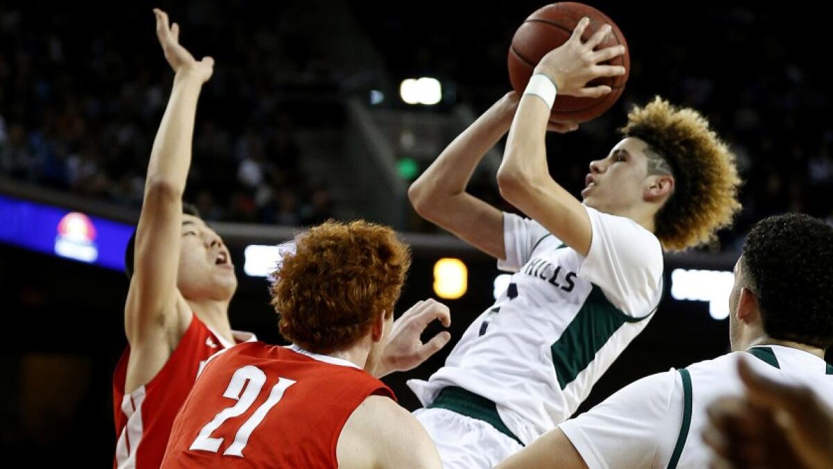 Chino Hills High guard LaMelo Ball pulls up for a shot over Mater Dei’s Michael Wang and Matthew Weyand (21) in 2017.