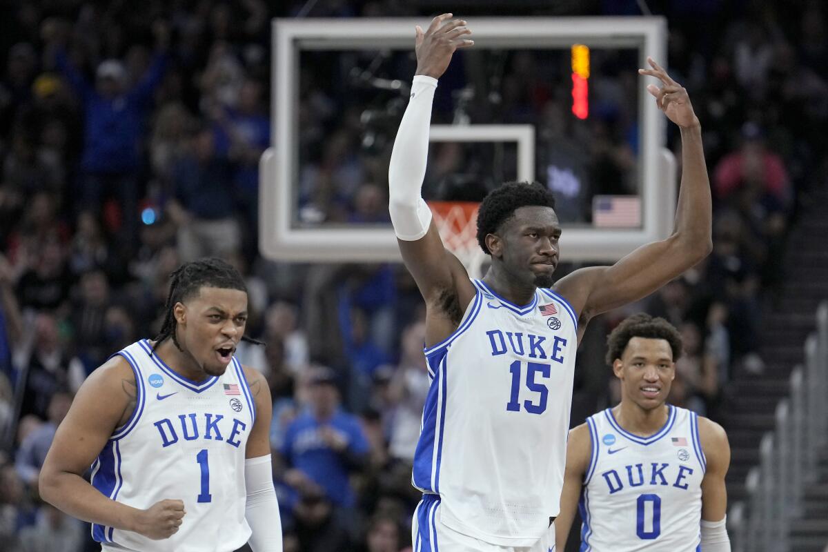 From left, Duke's Trevor Keels, Mark Williams and Wendell Moore Jr. are pumped up during the second half March 26, 2022. 