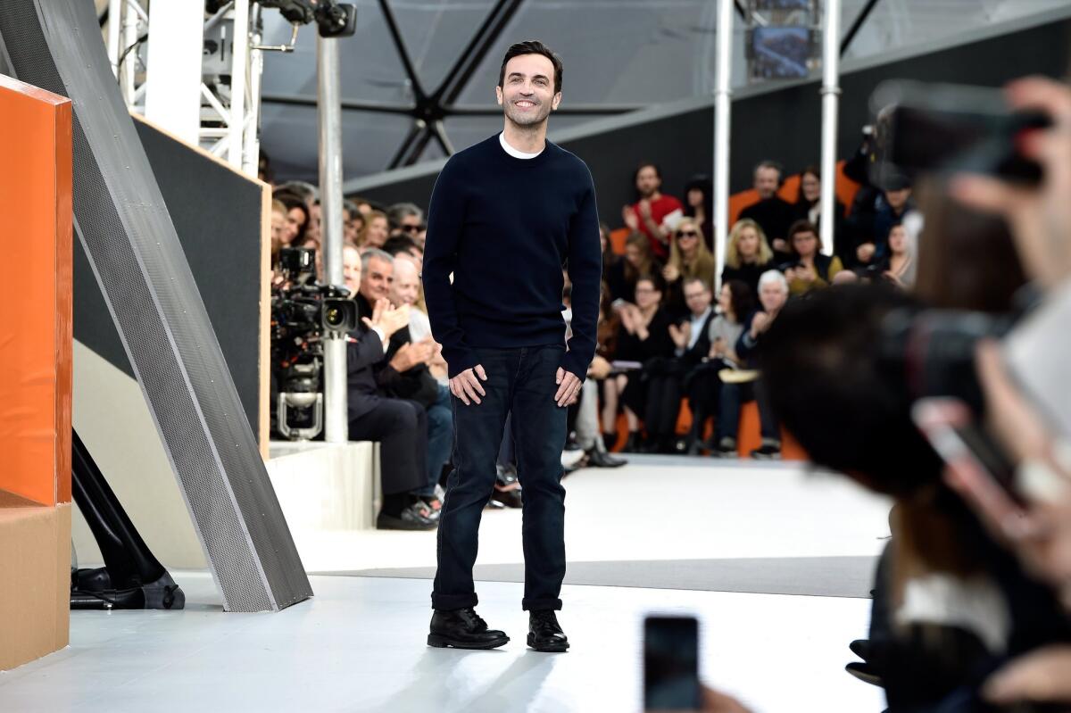 Louis Vuitton artistic director Nicolas Ghesquiere appears at the end of the Louis Vuitton runway show Wednesday, the last blockbuster show on the Paris Fashion Week calendar.