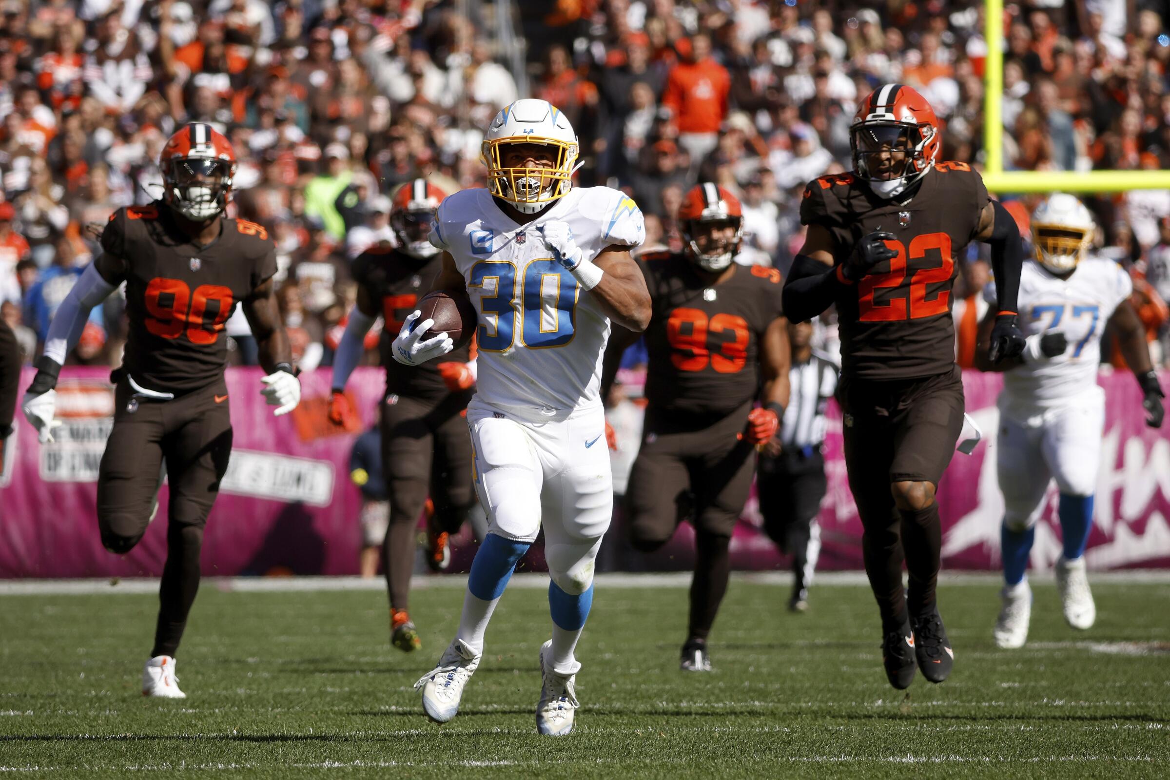Chargers running back Austin Ekeler (30) runs against the Cleveland Browns, Sunday, Oct. 9, 2022, in Cleveland. 