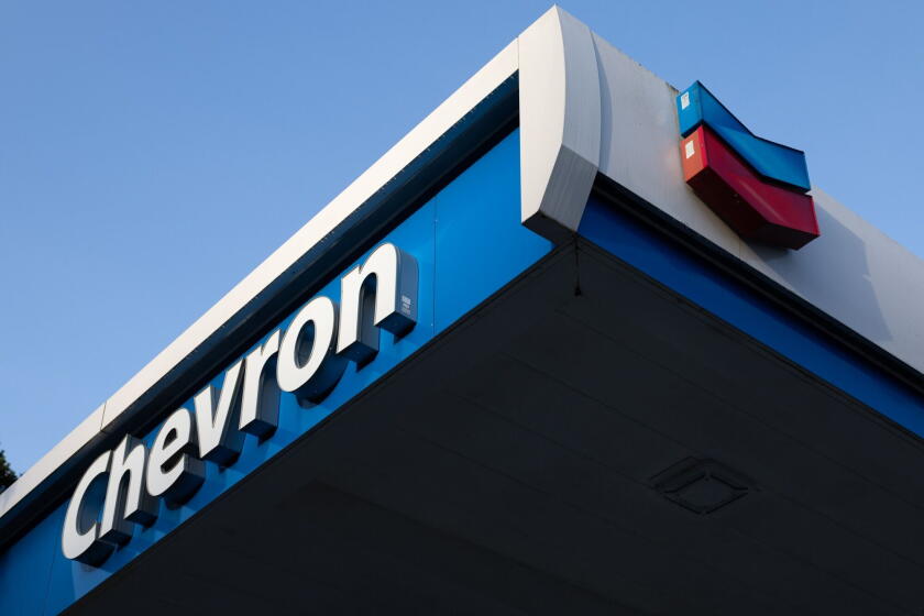 Signage at a Chevron gas station Photographer: Benjamin Fanjoy/Bloomberg