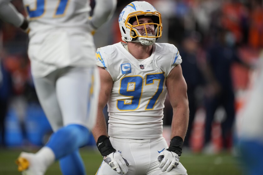 Los Angeles Chargers defensive end Joey Bosa (97) kneels after the Denver Broncos scored a touchdown.