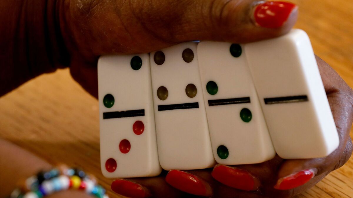 Bobbie Simmons holds her dominoes during the tournament Tuesday.