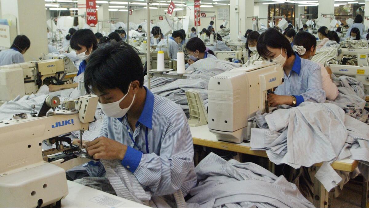 Vietnamese workers in 2007 sew shirts to be exported to the United States.
