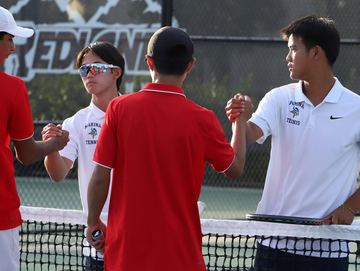 Marina's Darren Le, left, and Trevor Nguyen shake hands with their Woodbridge opponents after winning a set on Friday.