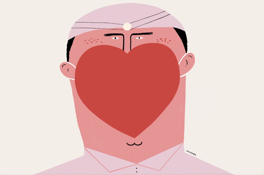 A dentist is wearing a mask in the shape of a heart.