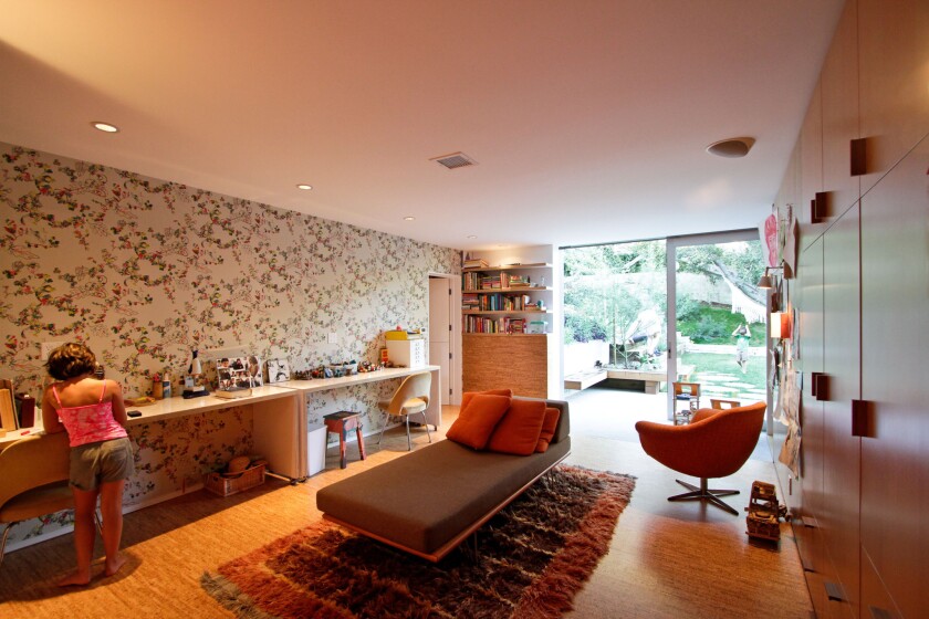 Daks wallpaper from Walnut Wallpaper in Los Angeles adds colorful detail to the children's wing in the Los Feliz home of filmmaker and KCET producer Juan Devis and artist Laura Purdy.