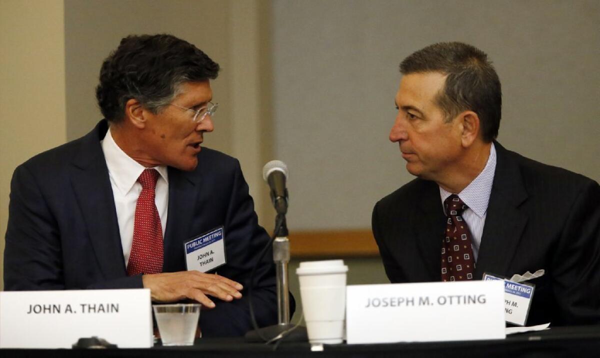 Bank regulators have approved CIT Group's takeover of OneWest Bank in Pasadena. Above, CIT Chief Executive John Thain and Onewest CEO Joseph Otting appeared at a Federal Reserve hearing on the merger in February.