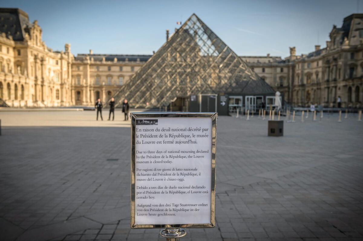 In the wake of the Paris attacks, museums in the city were shut down. A sign advises people of the closed Louvre on Sunday. Institutions reopened today.