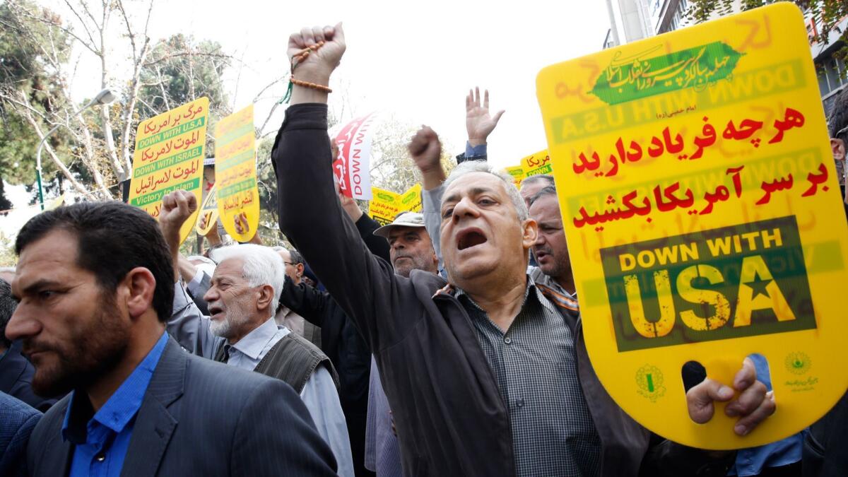 Iranians take part in an anti-U.S. demonstration marking the 39th anniversary of the U.S. Embassy takeover, in Tehran on Nov. 4, 2018.