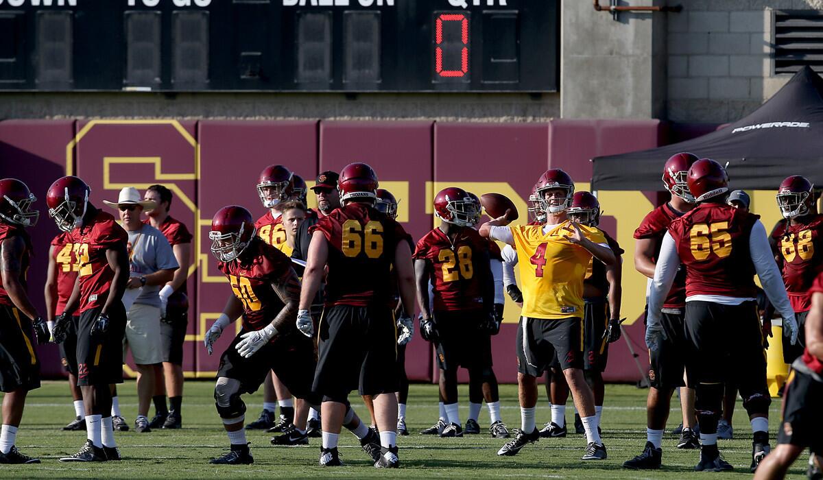 USC football players work out on the first official day of football practice on Aug. 4 at Howard Jones Field on the campus of USC.