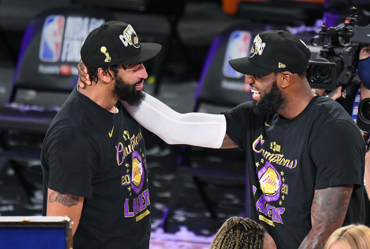 Anthony Davis and LeBron James celebrate after defeating the Heat on Oct. 11, 2020, to win the NBA title.