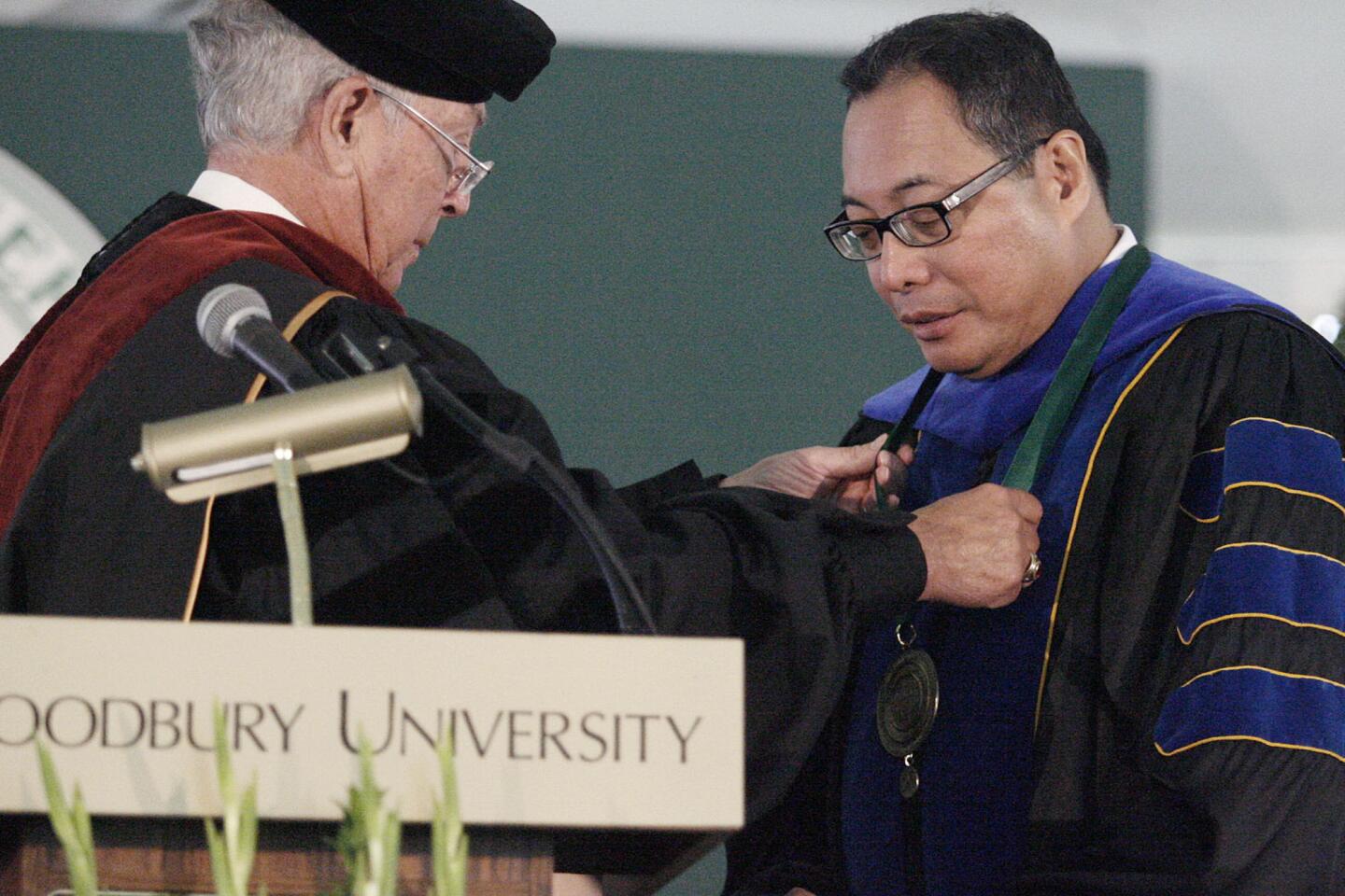 Chairman Board of Trustees Robert W. Kummer, Jr., left, puts on a medallion on Luis Ma R. Calingo during the inauguration and installation of Woodbury's 13th president, which took place at Woodbury University in Burbank on Saturday, October 20, 2012.
