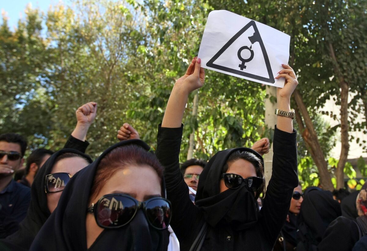 Iranian women, hiding their faces to avoid being recognized, in a protest last week against a spate of acid attacks in Isfahan, Iran.