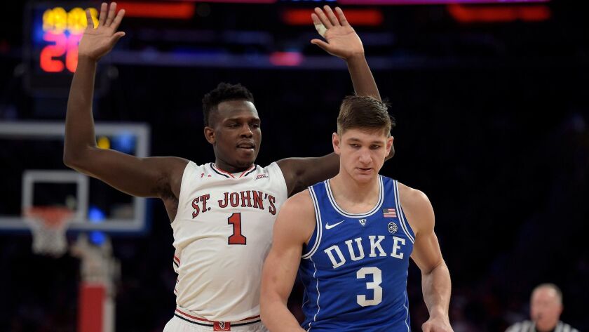 Bashir Ahmed of the St. John's Red Storm reacts after bumping into Grayson Allen of the Duke Blue Devils at Madison Square Garden.
