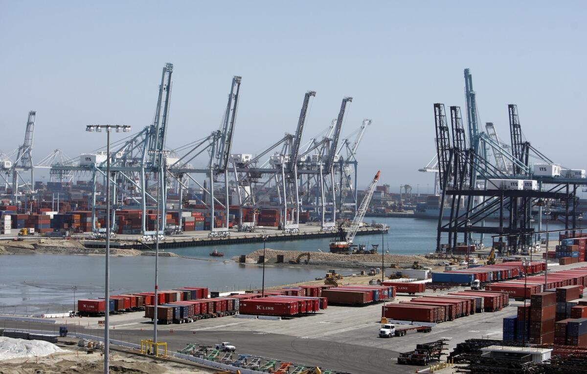 A Caterpillar subsidiary is being investigated by federal authorities who are looking into whether the rail repair firm illegally dumped train parts in the ocean near the Port of Long Beach, pictured above in 2011.