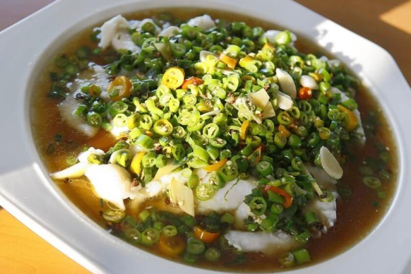 Sichuan-style fish is smothered with peppers at Taste of Chong Qing in San Gabriel.