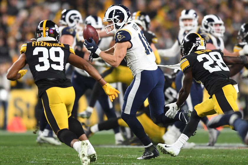 PITTSBURGH, PENNSYLVANIA NOVEMBER 10, 2019-Rams receiver Cooper Kupp drops a pass as Steelers safety Minkah Fitzpratrick (39) and cornerback Mike Hilton defend in the 4th quarter at Heinz Field in Pittsburgh Sunday. (Wally Skalij/Los Angerles Times)