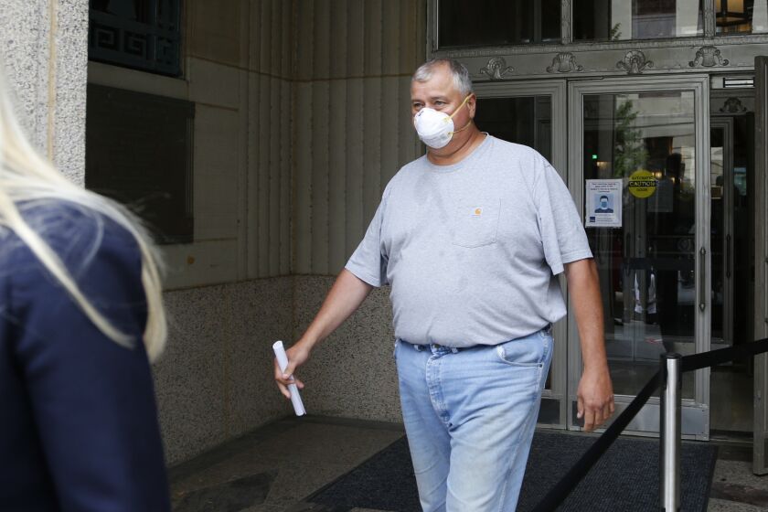 FILE - In this Tuesday, July 21, 2020, file photo, Ohio House Speaker Larry Householder leaves the federal courthouse after an initial hearing following charges against him and four others alleging a $60 million bribery scheme, in Columbus, Ohio. (AP Photo/Jay LaPrete, File)