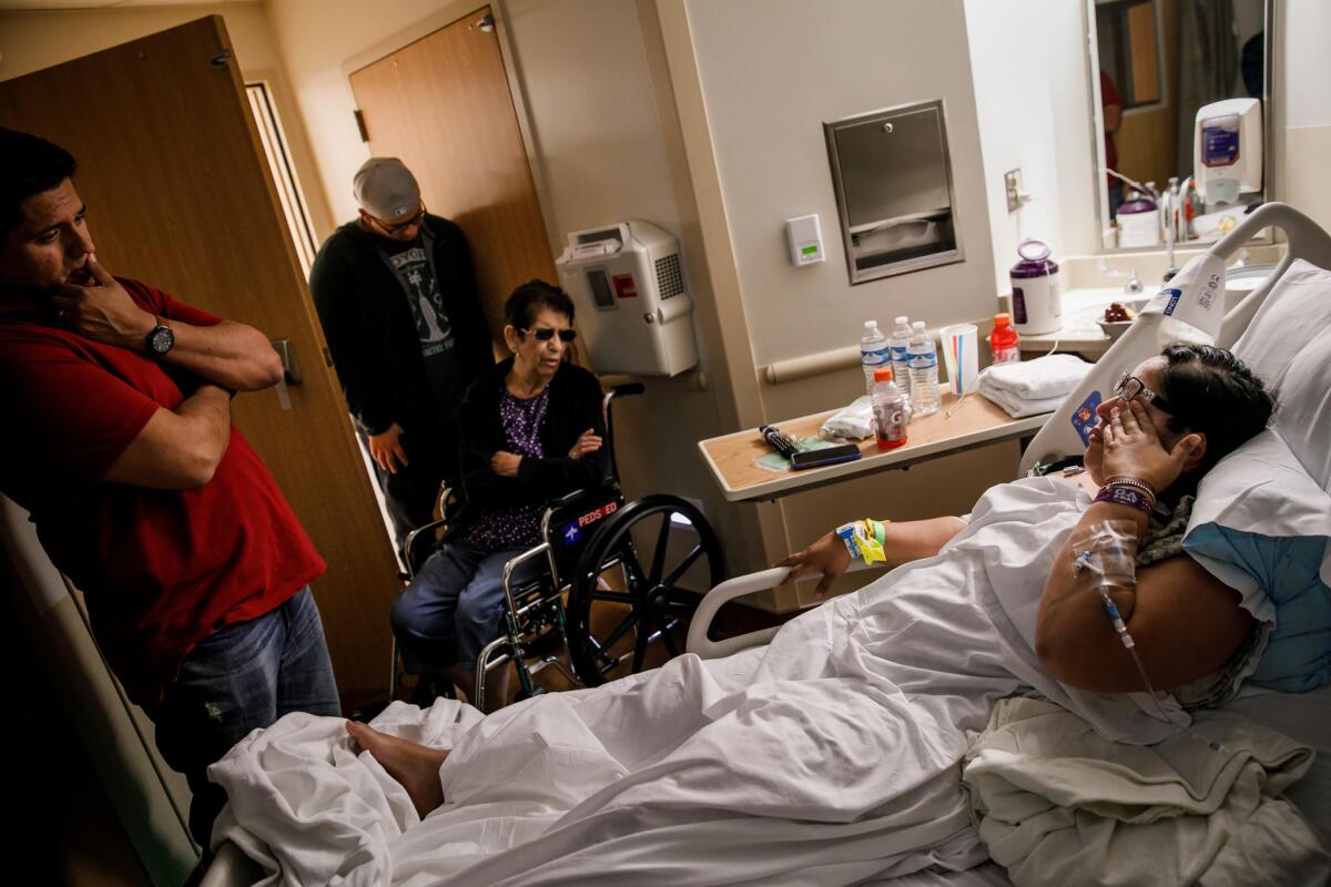 Carmen Algeria, who was hit in the knee during the mass shooting, at Sunrise Hospital in Las Vegas.