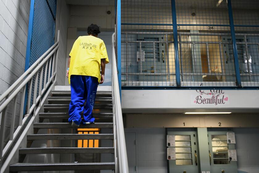 LOS ANGELES, CA-OCTOBER 2, 2017: An inmate inside Century Regional Detention Facility in Los Angeles heads towards her upstairs cell on Monday, October 2, 2017. The jail, which houses female inmates, is where two alleged rapes by a male guard happened earlier this month. The alleged assaults came at a time when the Los Angeles County Sheriff's Department, which runs the jail, is trying to implement changes to ensure the sexual safety of inmates and become compliant with a federal mandate to eliminate prison rape. (Christina House / Los Angeles Times)