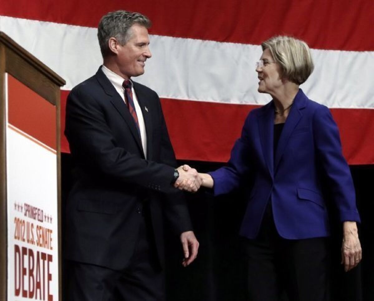 Republican Sen. Scott Brown shakes hands with Democratic challenger Elizabeth Warren prior to a debate in Springfield, Mass., on Oct. 10.