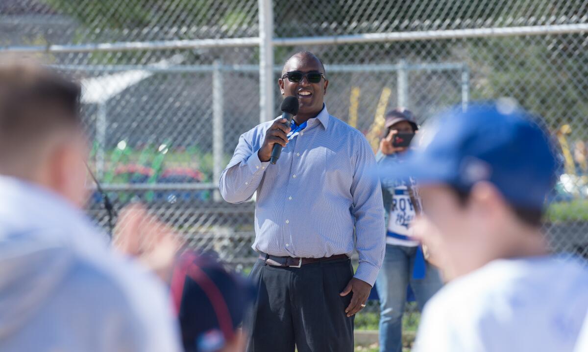 Tony Reagins talks to participants before an MLB youth event April 3, 2016, in Kansas City, Mo.