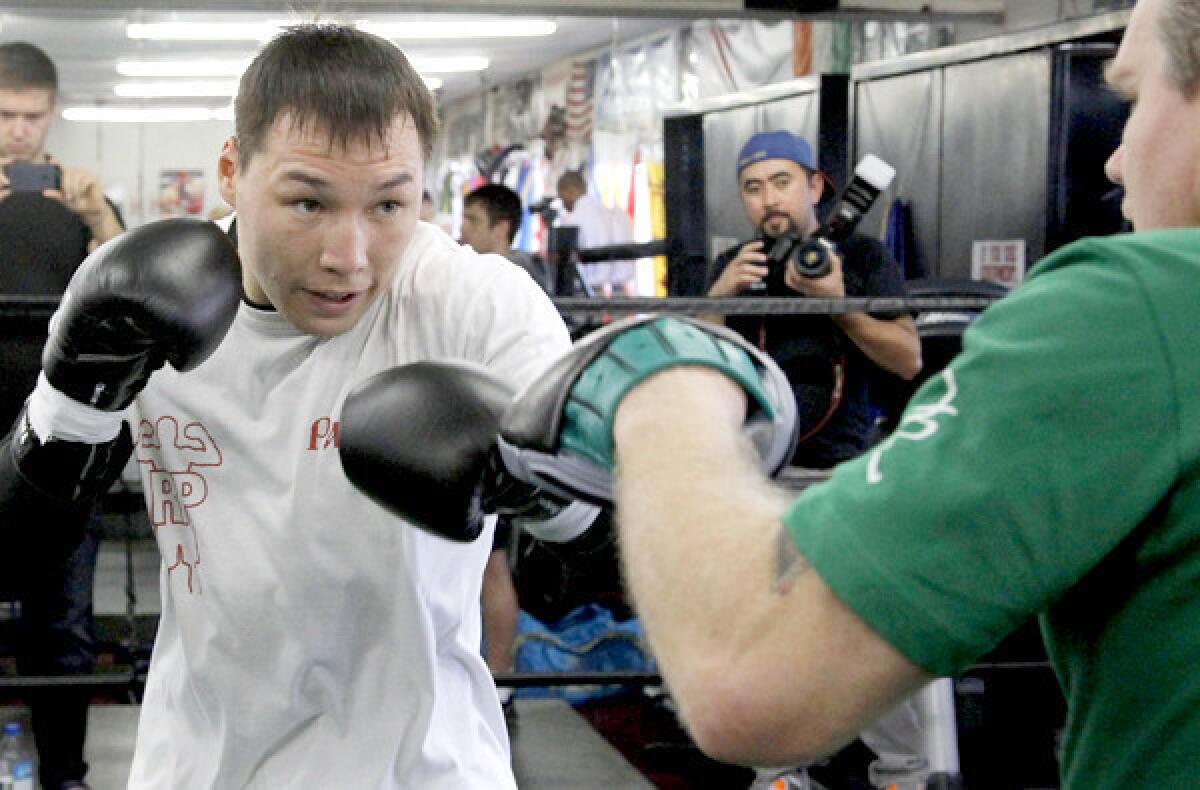 Ruslan Provodnikov works out with trainer Freddie Roach on Friday.