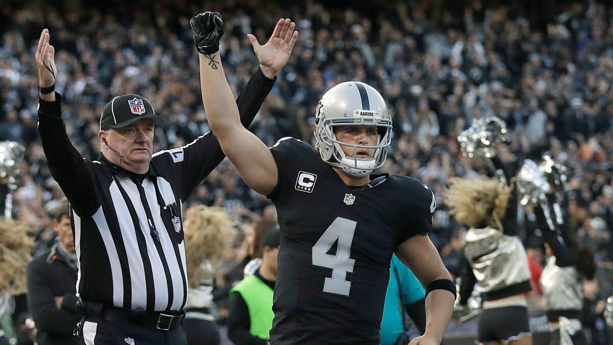 Oakland Raiders quarterback Derek Carr celebrates after throwing for a two-point conversion against the Carolina Panthers in a Nov. 27, 2016, game in Oakland.