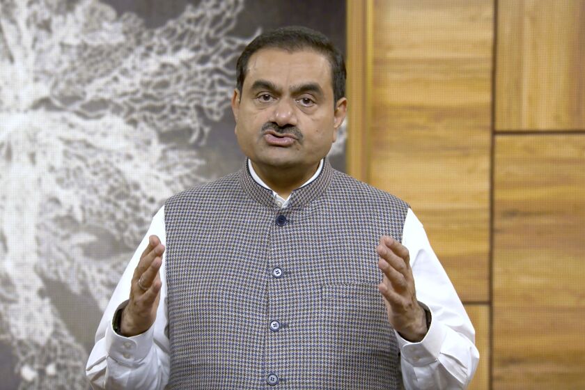 This grab from video released by Adani Enterprises ltd on Thursday, Feb.2, 2023 shows Indian billionaire Gautam Adani addressing investors from an unknown location. Adani called off his flagship company's $2.5 billion share sale late Wednesday after a tumultuous week saw his conglomerate shed tens of billions of dollars in market value after claims of fraud from a U.S.-based short-selling firm. (Adani Enterprises ltd via AP)