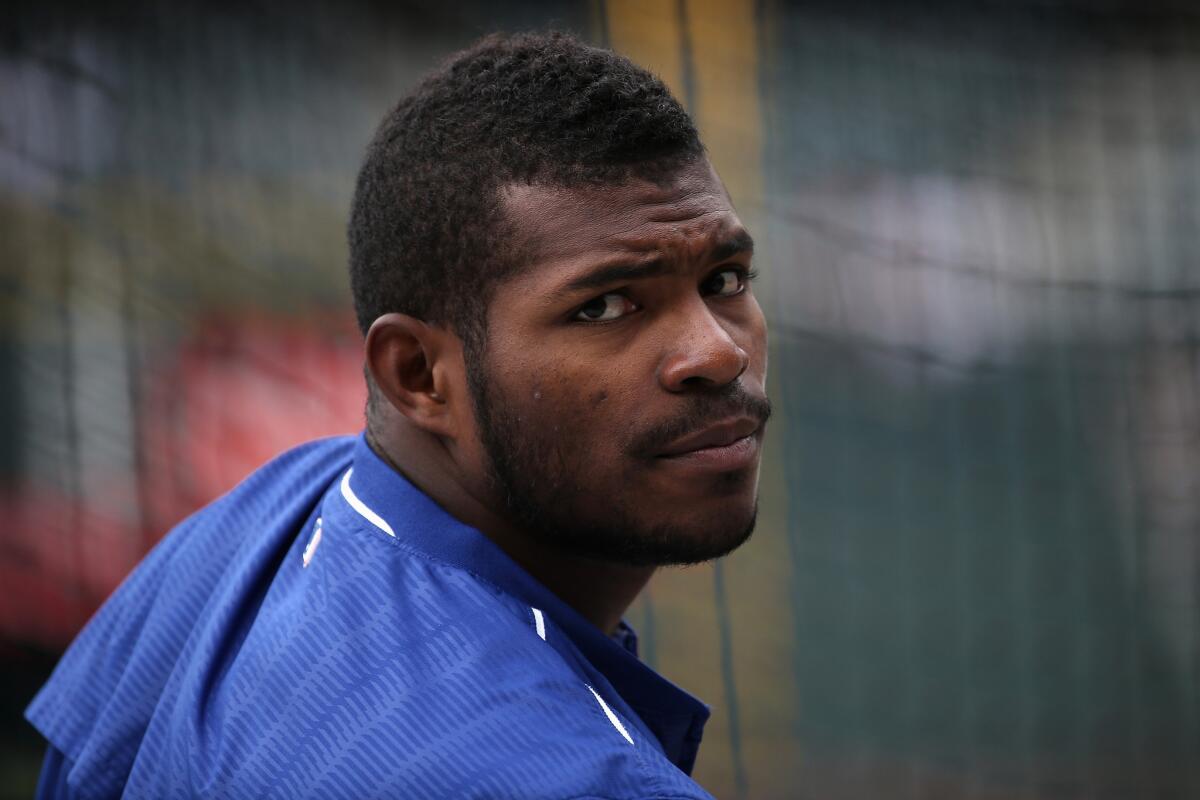Dodgers outfielder Yasiel Puig (66) takes batting practice prior to facing the Colorado Rockies at Coors Field on April 23.
