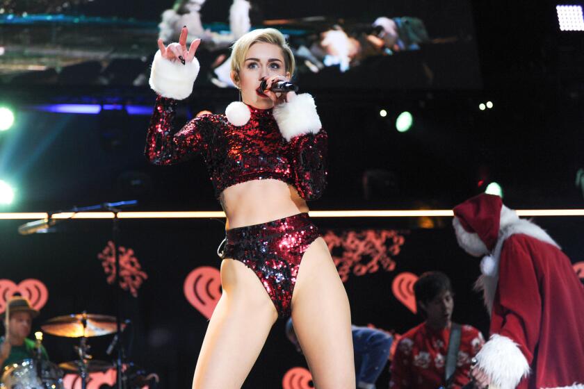 Singer Miley Cyrus performs at Jingle Ball 2013 at Madison Square Garden.