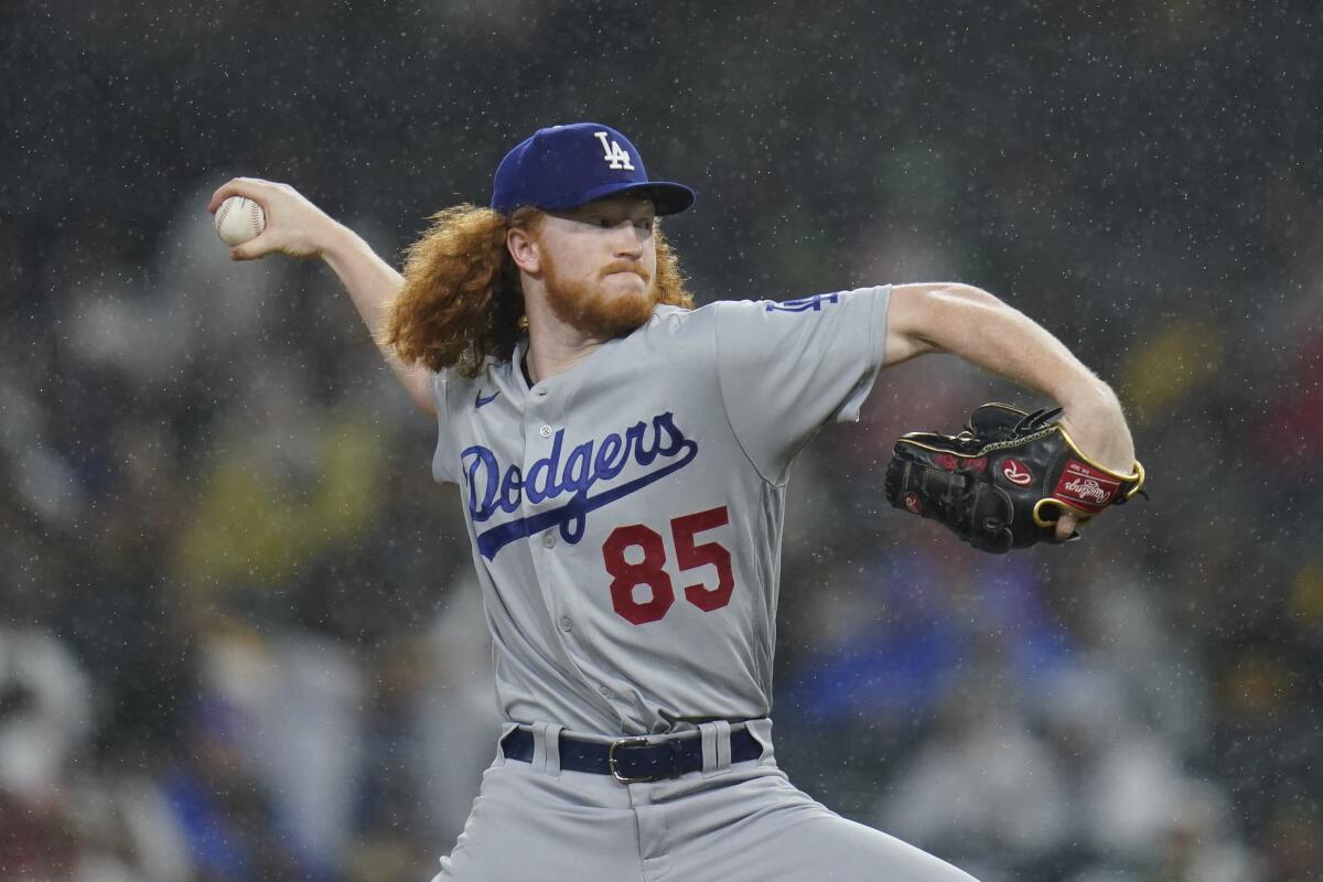 Dodgers starting pitcher Dustin May winds up to pitch.