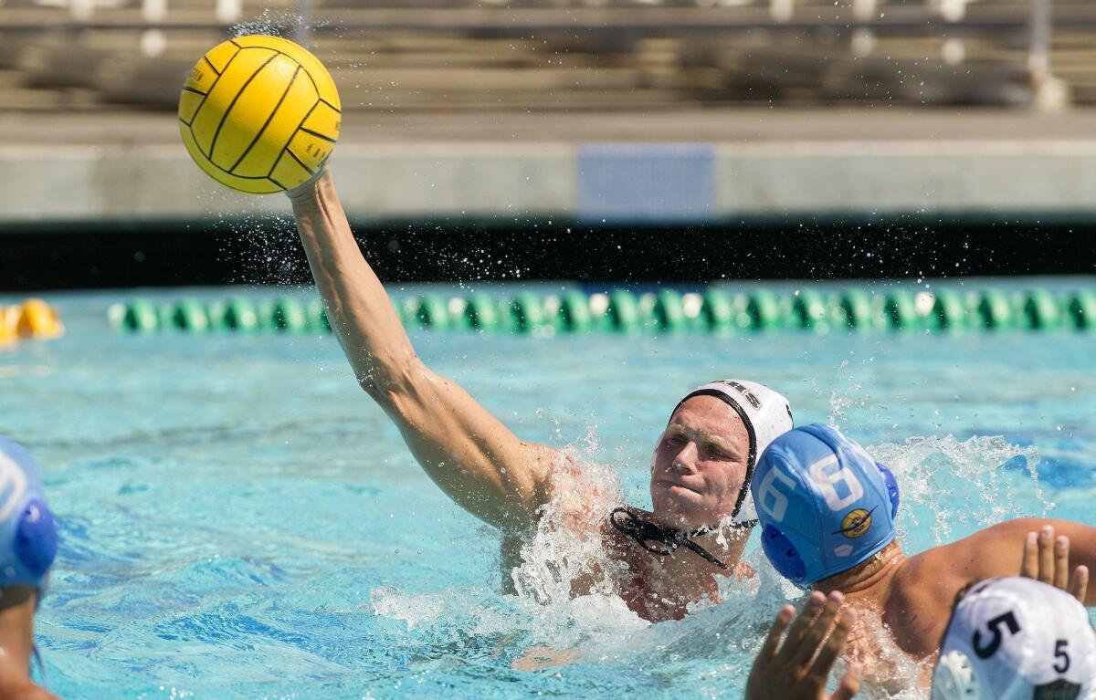 Huntington Beach High’s Ethan Wojciechowski scores during the second half against Corona del Mar in a semifinal match of the South Coast Tournament Beach on Saturday in Newport Beach.